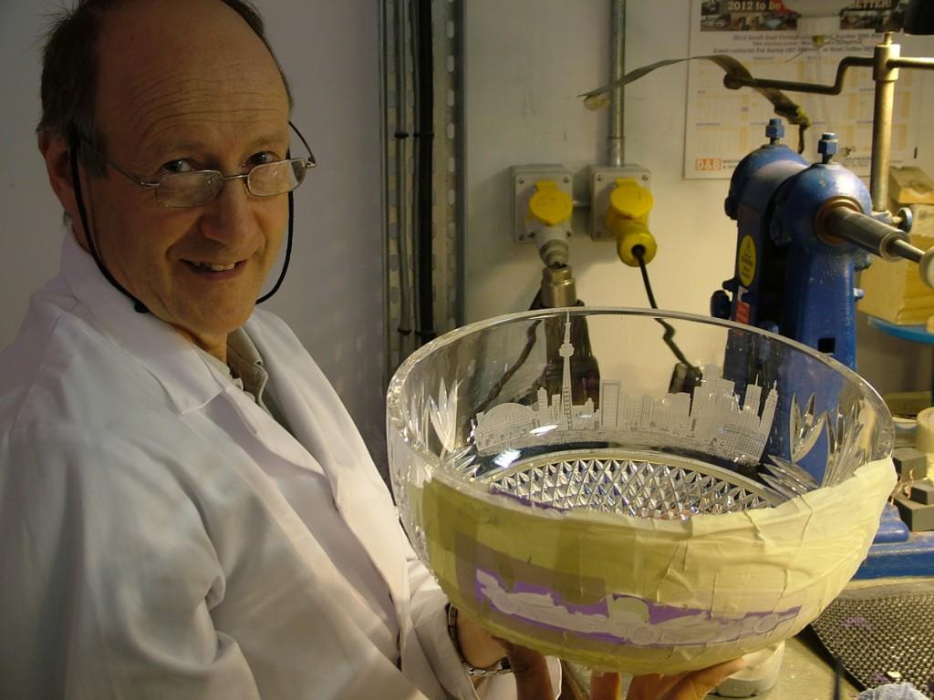 Our tour of the House of Waterford Crystal in Ireland master Waterford crystal carver holds Toronto Indy trophy - waterford crystal plant - ireland