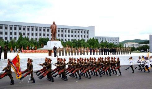 A KPA honor guard marches past a statue of late DPRK leader Kim Jong Il during a dedication ceremony for the statue at the KJI University of People's Security in Pyongyang on 19 July 2013 (Photo: Rodong Sinmun).