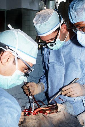 A thoracic surgeon performs a mitral valve rep...