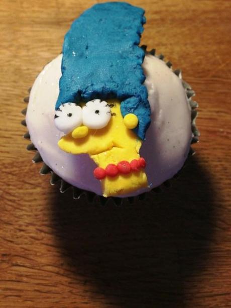 marge simpson hand crafted fondant cupcake on white icing background red pearl necklace