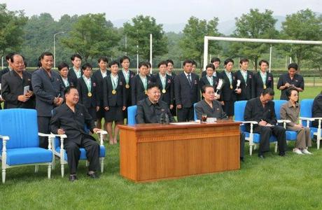 Kim Jong Un watches an archery competition between the 25 April Defense Sports Team and the Amnokgang Defense Sports Team.  Among those also seen attending the competition are the DPRK women's football (soccer) squad who won the 2013 EAFF cup, Jon Yong Nam (standing, 2nd L), VMar Choe Ryong Hae (seated, 3rd L), Jang Song Taek (seated, 3rd R) and Jang's wife and Kim Jong Un's aunt Kim Kyong Hui (seated, R) (Photo: Rodong Sinmun).