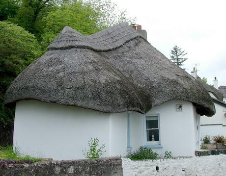 A Visit to Dunmore East, Ireland Had Us Feeling At Home thatched roof on a cottage at dunmore east in county waterford - ireland