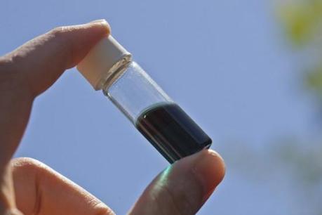 A vial holds a polymer “ink” that can be printed to make solar cells. (Credit: Yeechi Chen / UW)