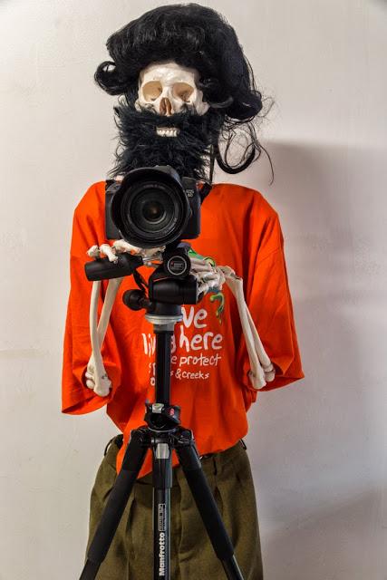 When he says smile, you smile. dressed skeleton using a camera