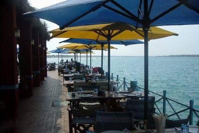Porto Marina A picture of one of the restaurants there are within the sea like an island