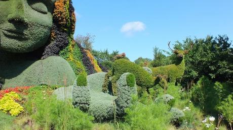 Mosaiculture 2013 at Montreal Botanical Garden Mother Earth (animals in her hand) - Mosaiculture - Montreal Botancial Gardens