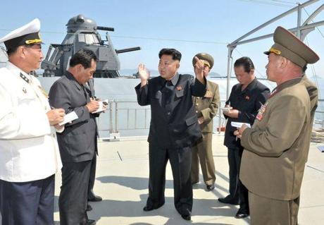 Kim Jong Un (3rd L) issues instructions during a field inspection of a newly commissioned KPA Navy warship (Photo: Rodong Sinmun).