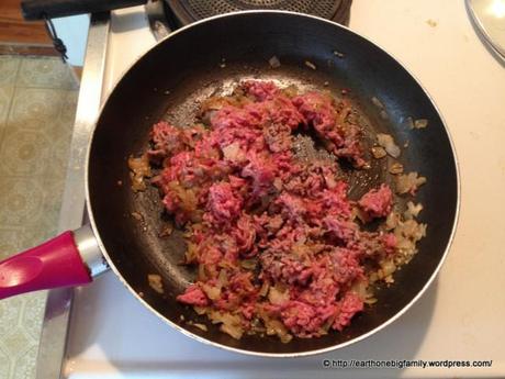 After the onions are cooked add meat and crumble it into small pieces using a spatula. The smaller the better.