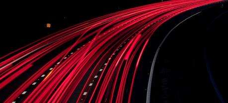Roads With a Contact Rail Could Solve Electric Car Charging Problem An electric road will consist of a large number of electrically conductive tapes—like the light trails on a night road. (Credit: Flickr @ Michael Rammell http://www.flickr.com/photos/mikerammell/)