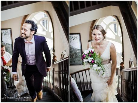 Bride and Groom Climb Stairs at venue | London Wedding photography by Dewan Demmer