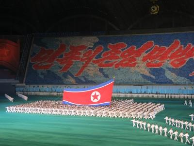 Watching the Mass Games on National Day in the May Day Stadium, Pyongyang, North Korea north korea flag mass games