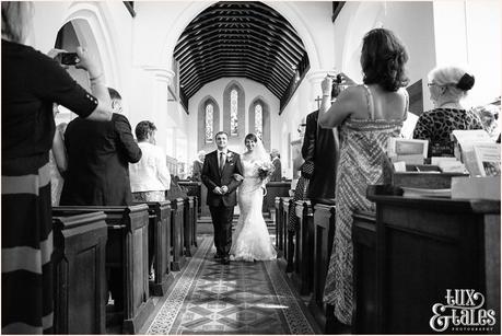 Bride and groom walk down the aisle in UK church 