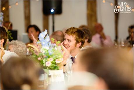 Wedding guest smiles in reportage style photograph