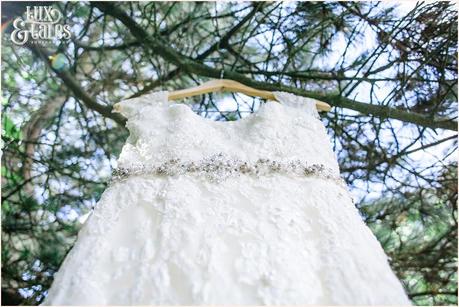 Wedding Dress photographed from an upwards angle with lace and bead detail 