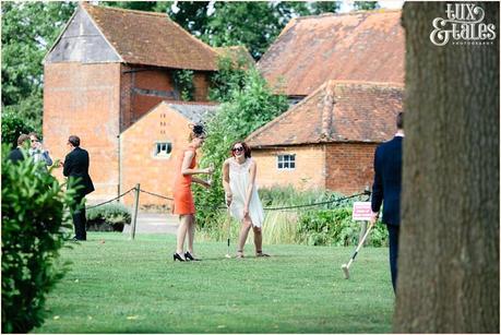 Wedding guests playing croquet