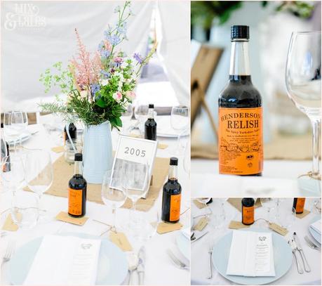 Wedding table detail including sheffiled made hendersons relish bottles with a water jug holding wildflowers in the centre