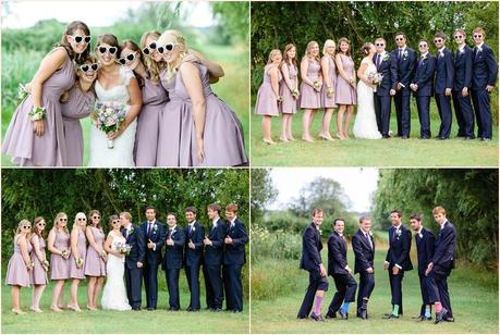 Fun group wedding poses including coloured socks and hear shaped glasses taken in the UK at old green barn 