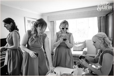 bridemaids getting ready for wedding in UK wearing silly sunglasses