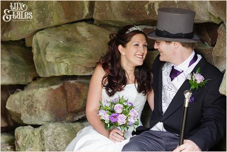 Bride and groom sitting in cave at Woburn Abbey Wedding 