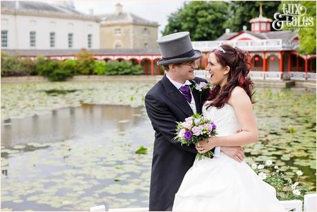 Bride and groom pose in front of Chinese building at Woburn Abbey 