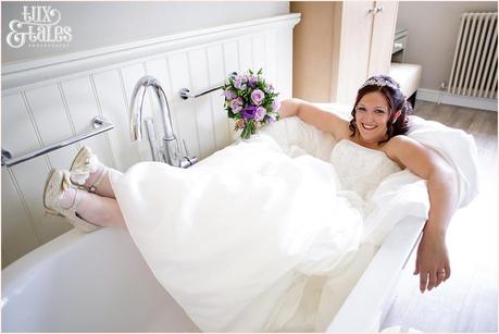 Bride sitting in bathtub at woburn Abbey Wedding 