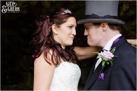 Bride and groom making faces at each other being silly at Woburn Abbey Wedding 