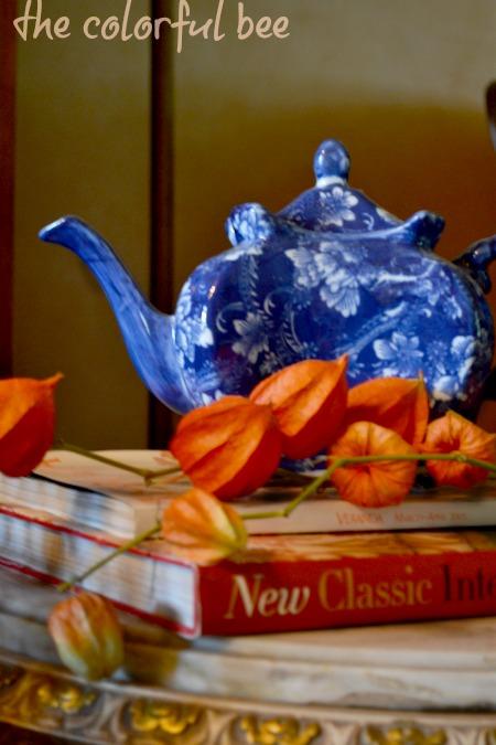blue teapot and orange Chinese lantern pods