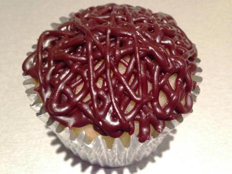abstract design chocolate cupcake icing using thin piping nozzle and silver spoon designer icing