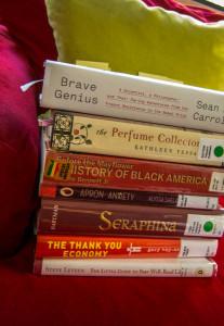 Dewey’s Read-a-Thon Introduction Post Stack of books in an armchair with pillow