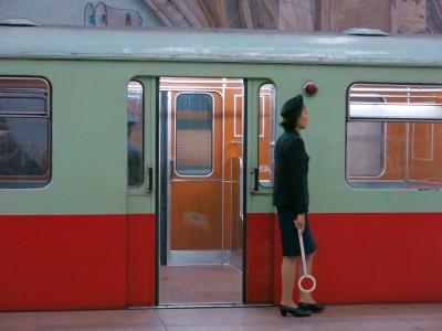 Revival to Glory: Riding on the Pyongyang Metro, North Korea train lady in pyongyang