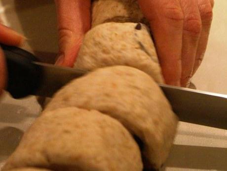 Cut into eight Olive and parmesan bread rolls
