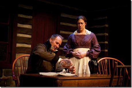 Con (Frank Nall) serves himself up a bit of the hair of the dog as faitful Nora (Sally Eames) watches, in The Artistic Home's 'A Touch of the Poet,' by Eugene O'Neill. (photo credit: Tim Knight) Frank Nall and Sally Eames - The Artistic Home