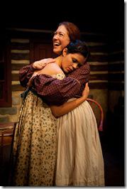 Love-sick Sara (Elizabeth Argus) seeks comfort from her mother, Nora (Sally Eames) in The Artistic Home's 'A Touch of the Poet,' by Eugene O'Neill. (photo credit: Tim Knight) Elizabeth Argus and Sally Eames - The Artistic Home