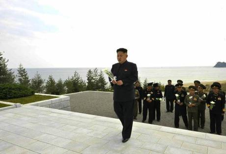 Kim Jong Un brings a bunch of flowers to a memorial at a cemetery for KPA Navy officers and service members killed in action in October 2012 (Photo: Rodong Sinmun).