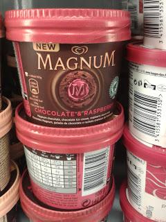 magnum ice cream with raspberry sauce and magnum milk and dark chocolate pieces