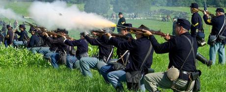 Union soldiers fire a volley at Confederate troops during re-enactment of the Battle of Gettysburg on June 28, 2013.