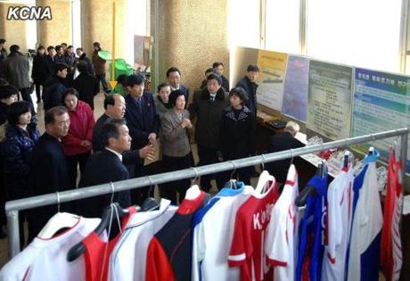 Minister of Physical Culture and Sports Ri Jong Mu (highlighted) tours the National Exhibition of Sports Science and Technology in Pyongyang on 19 November 2013 (Photo: KCNA).