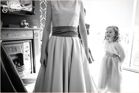 Yorkshire Wedding Photography | Katie & Gavin Got Married! Little girl watches as bride gets her dress on at Swanland Wedding