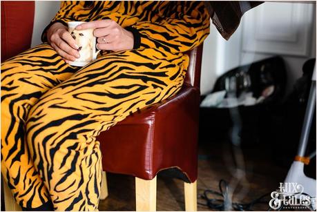 Yorkshire Wedding Photography | Katie & Gavin Got Married! Bride in tiger onsie holds mug with picture of labrador