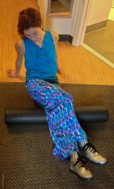 Me getting my roll on. This is a good way to reach the behind-the-knee/upper calf area. You won't believe how sore/tight it is!