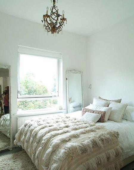 varying shades of white and off white and texture in a beautiful bedroom