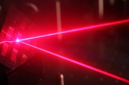 A laser being used to understand why plastic solar cells are efficient.