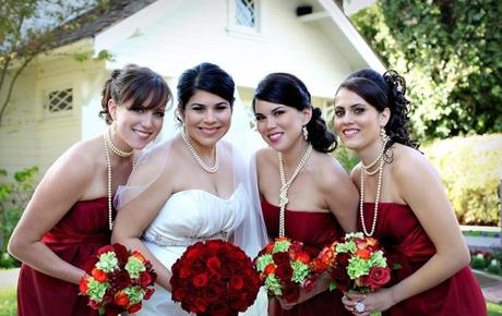 Dark red bridesmaid dresses and red bridal bouquet