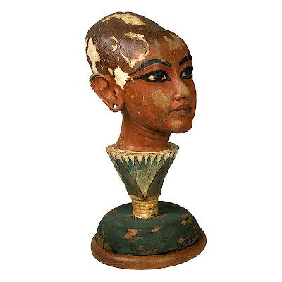 Head statue of Tutankhamen as Sun-god emerging from a Lotus Head statue of Tutankhamen as Sun-god emerging from a Lotus