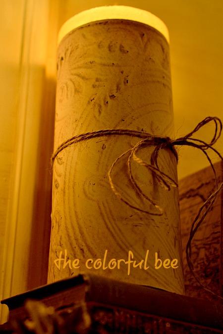 A Winter Mantel and an Online Class in Photography candle covered with faux tin ceiling paper and twine