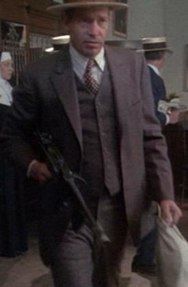 Truth vs. Fiction: The Bank-Robbing Style of Warren Oates as Dillinger A very Dillinger-esque Warren Oates as John Dillinger, leaving a South Bend bank job in 1973's Dillinger.