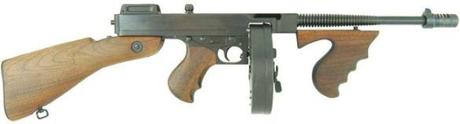 Truth vs. Fiction: The Bank-Robbing Style of Warren Oates as Dillinger A Thompson submachine gun, Model 1928. This has the Cutts compensator, the vertical handgrip, and the drum magazine that all became part of the popular gangster/Tommy gun association. The full stock was often removed by gangsters like Dillinger for easier mobility and concealment.