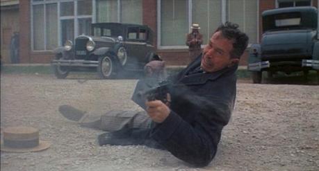 Truth vs. Fiction: The Bank-Robbing Style of Warren Oates as Dillinger Poor Dillinger has to do all the dirty work while Van Meter just dilly-dallies in the background. Seriously, what is Harry Dean Stanton doing back there? Picking a cuticle?