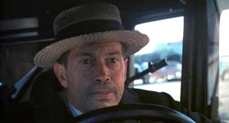 Truth vs. Fiction: The Bank-Robbing Style of Warren Oates as Dillinger You'd think on a big day like a bank robbery, Dillinger would try and wear a clean hat.