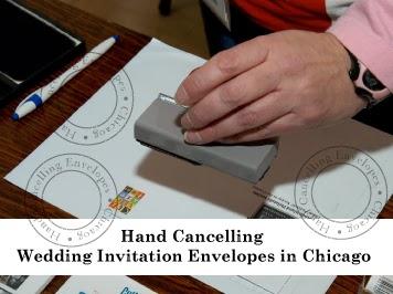 Hand Cancelling Wedding Invitation Envelopes in Chicago